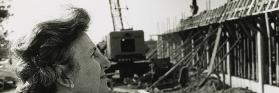 Bonnie Cone looking at the Library Building under construction in 1963.